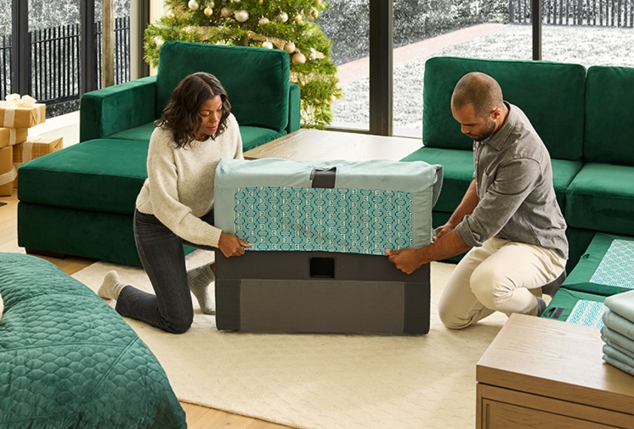 Woman Changing Covers on Lovesac Sactional