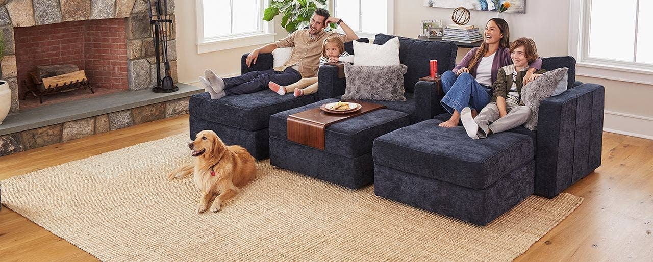 A family relaxing on a Sactionals couch